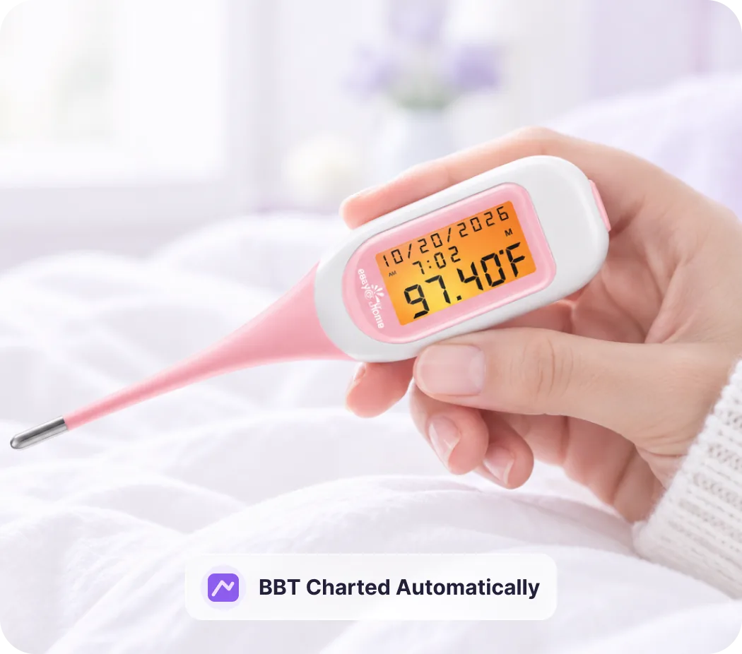 Hand holding a Premom smart basal body temperature thermometer
