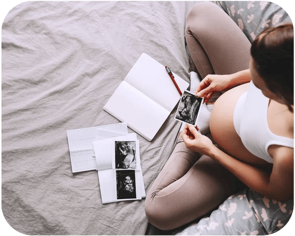 Woman writing her Premom story