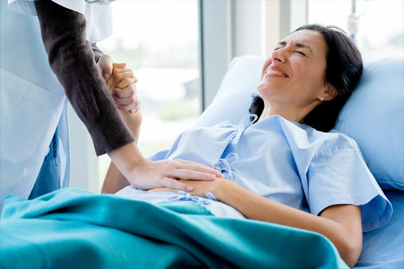 women in pain struggling with an ectopic pregnancy