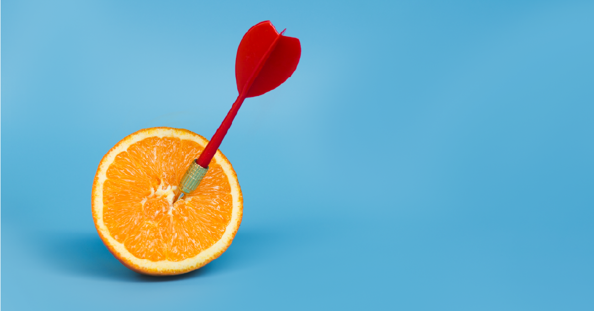 orange with a dart in the center indicating trying to predict ovulation and chances of pregnancy